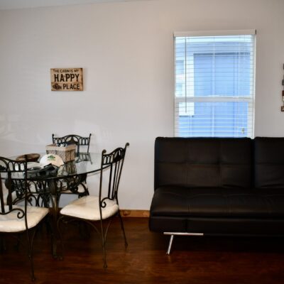 A Living Room Filled With Furniture And A Fireplace