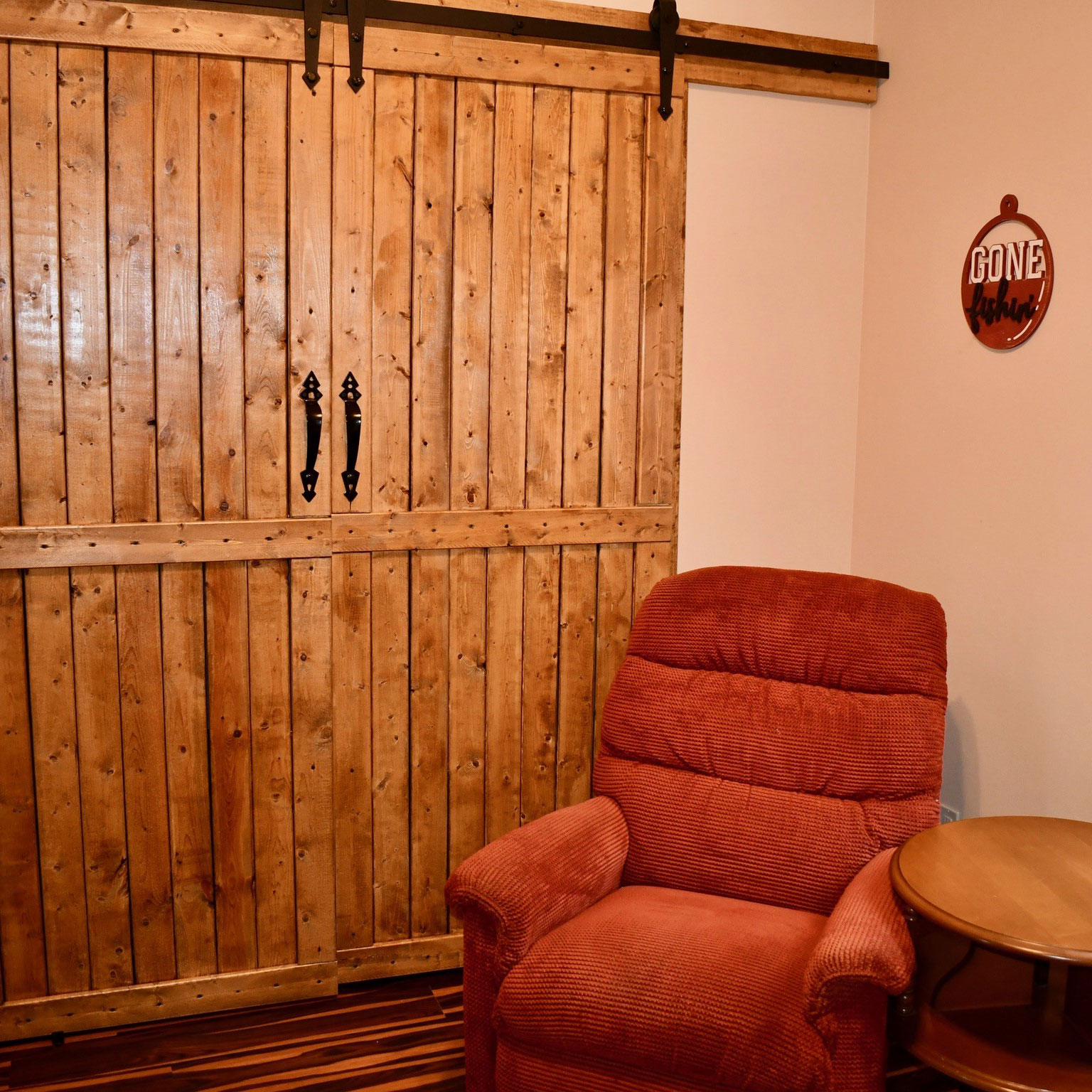 a living area with wooden wheels in a room